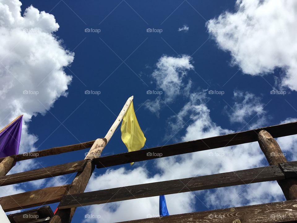 Flags in wind, clouds and blue sky