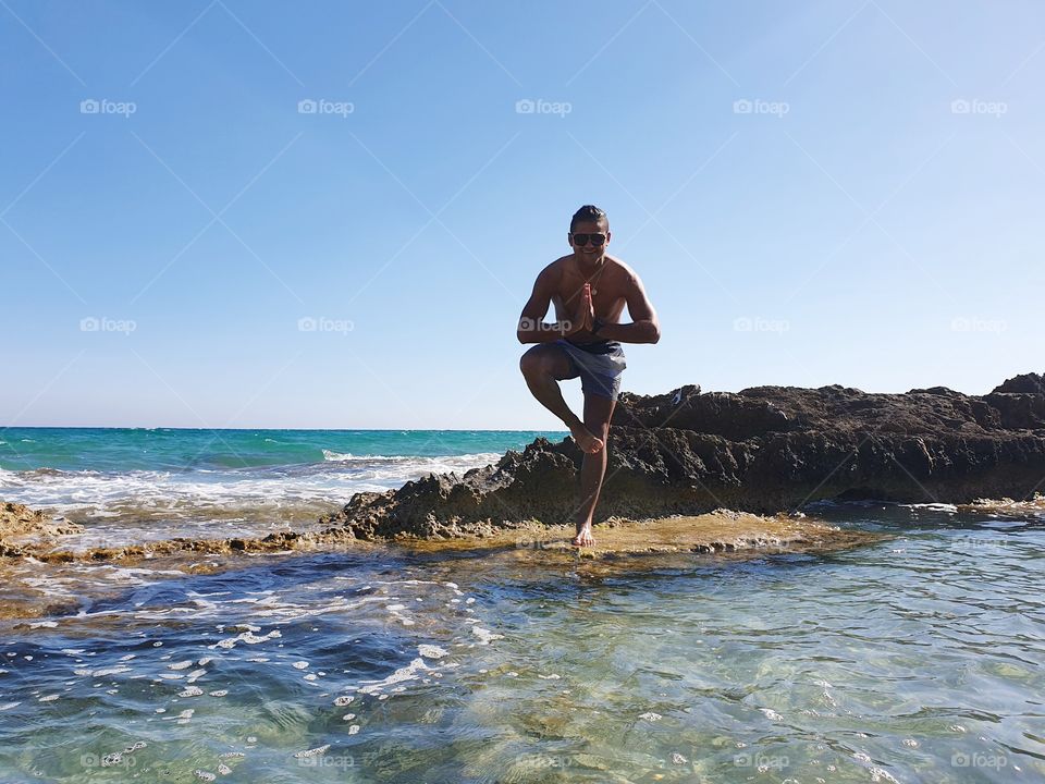 Yoga#training#balance#concentrated#exercise#sea#rock#body#position