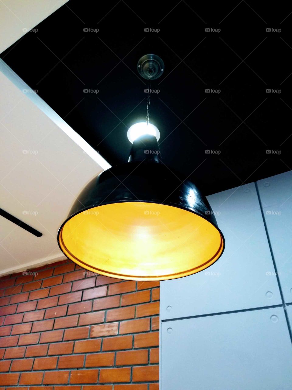 a beautiful hanging light in KFC restaurant