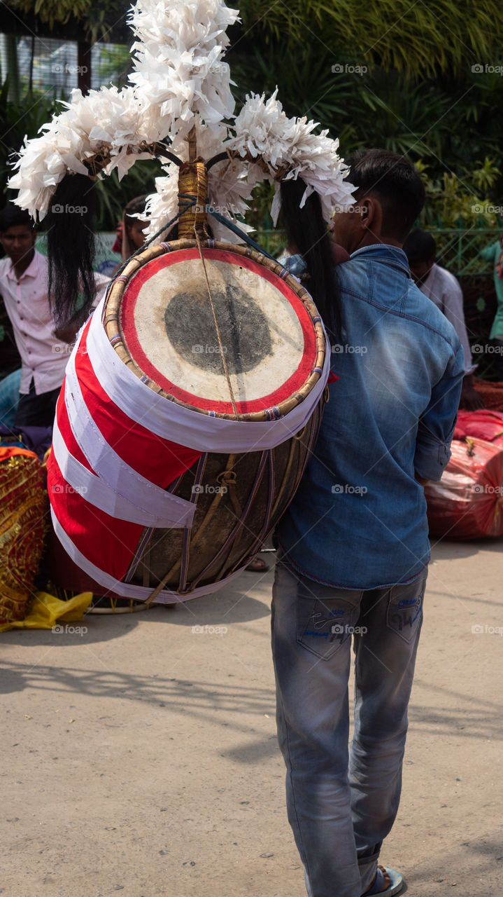 Dhakis (Bengali: ঢাকি) are traditional drummers who play the dhak (drum) during Hindu festivals, primarily in Bengal. Drum beats are an integral part of the five-day-long annual festivities associated with Durga Puja.