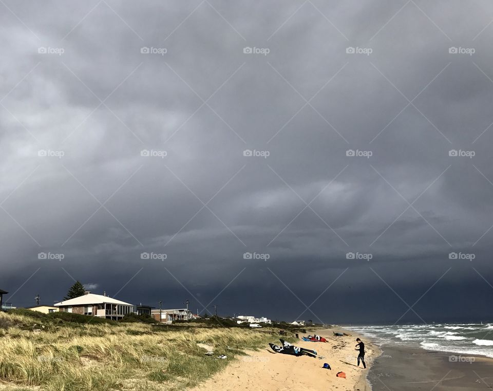 Beach walk with a huge storm approaching. Carrum Beach, Melbourne Victoria Australia 