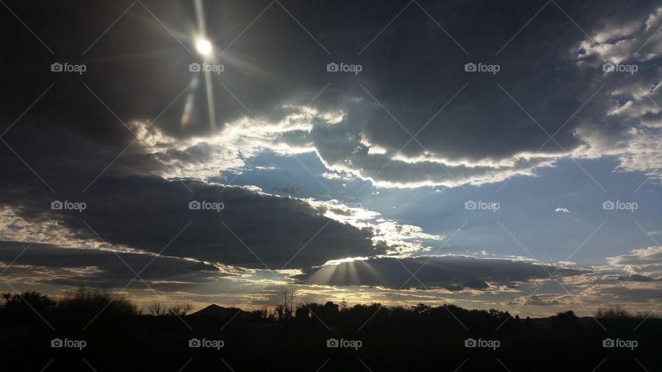 Sun Rays Over the Desert with clouds