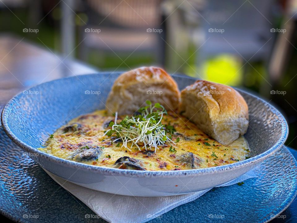 Snails swimming in cheese and garlic 