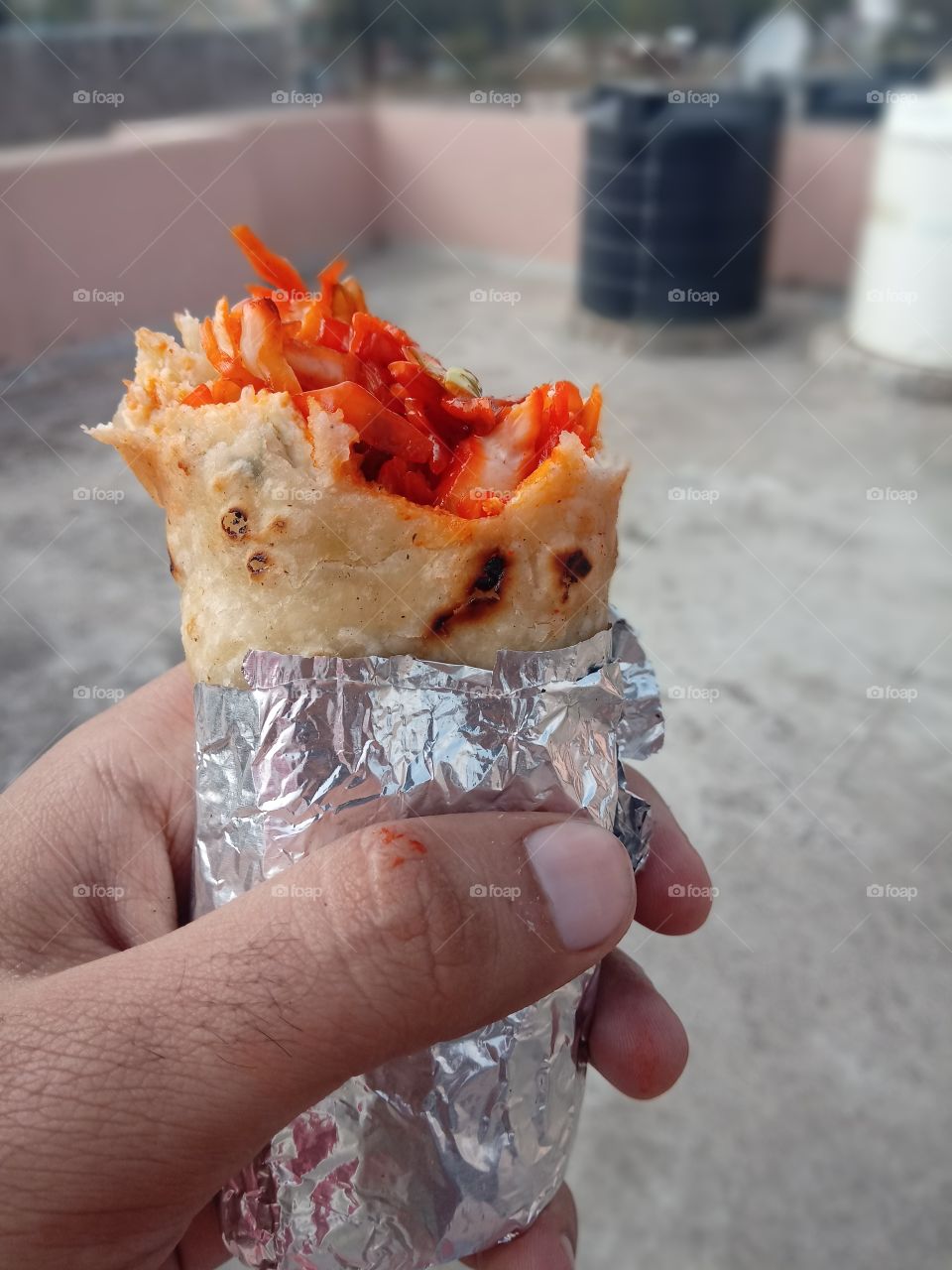 egg rolls eating holding and eating food