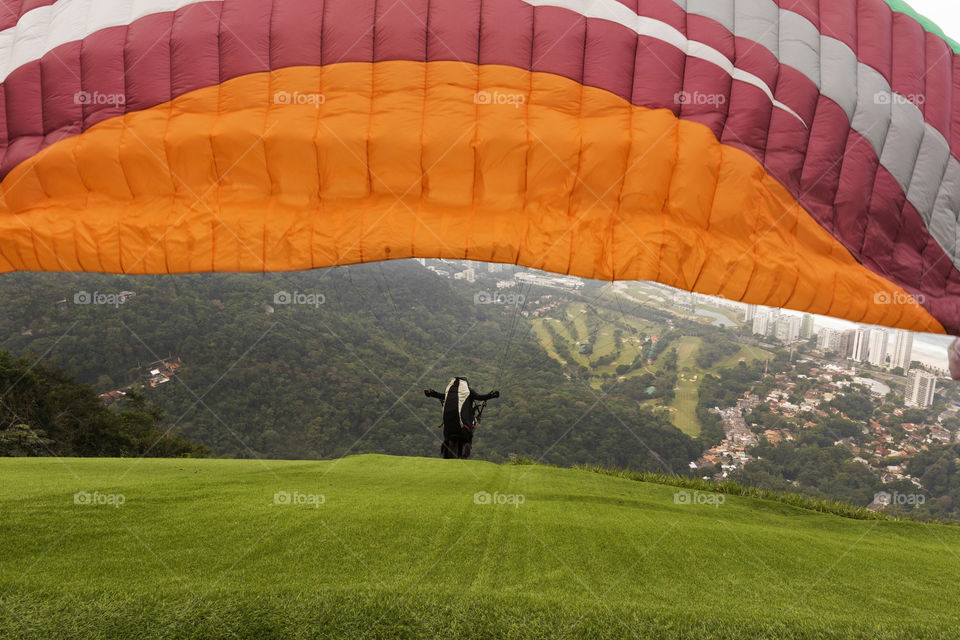 Parachute flying in sky