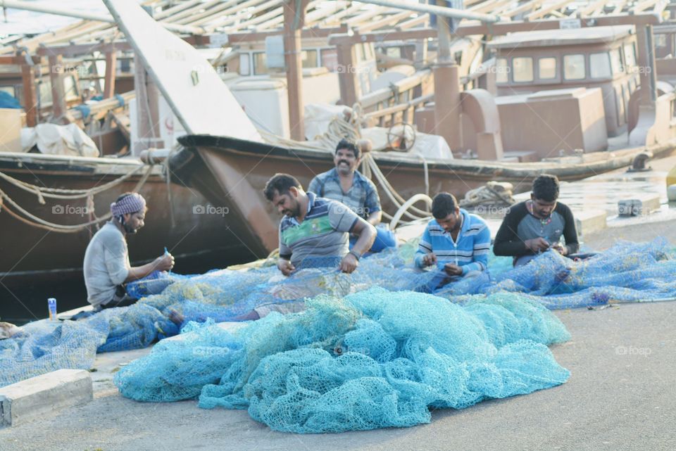 Fishermen at work with their fishing nets. Happy and contended. No distractions, no notifications.