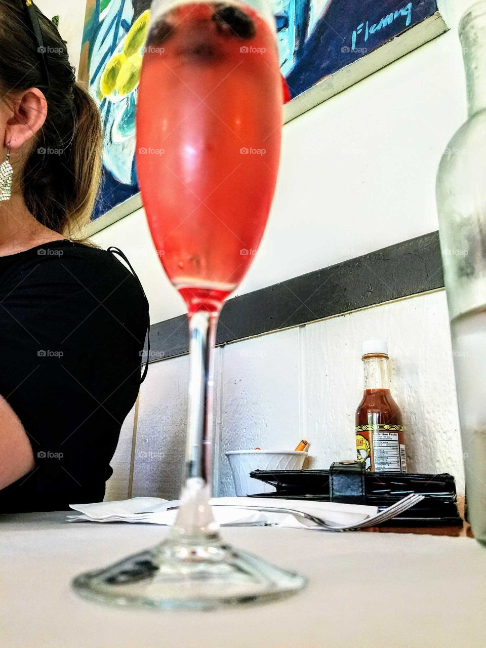 A Tall Glass of Pomagranite Mimosa on a hot Summer Day