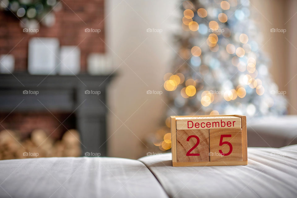 Christmas background with wooden block calendar with the date of December 25