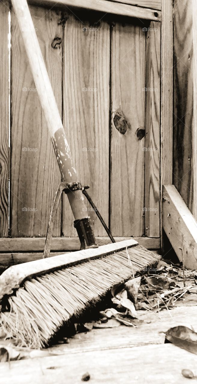 broom  leaves wooden decking