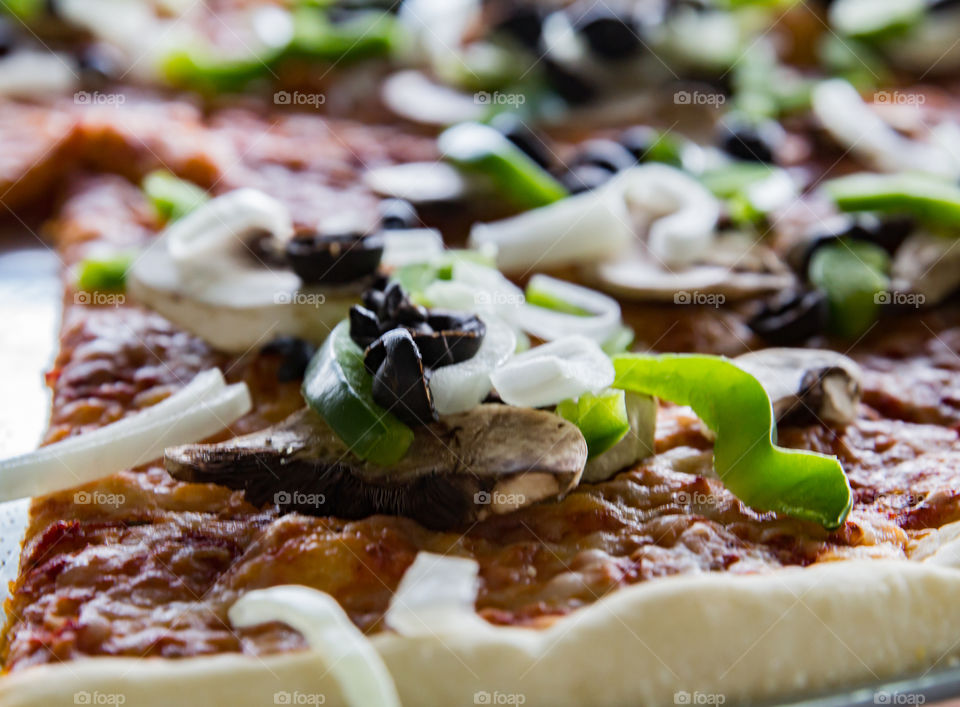 A close up of a slice of pizza