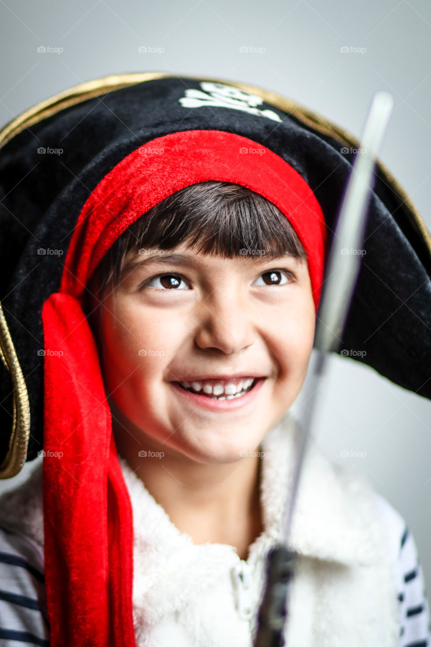 Happy little girl dressed as a pirate