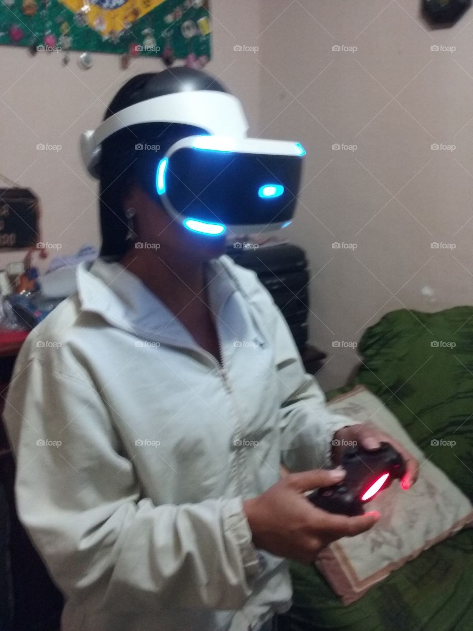 Woman playing video game with joystick on VR device