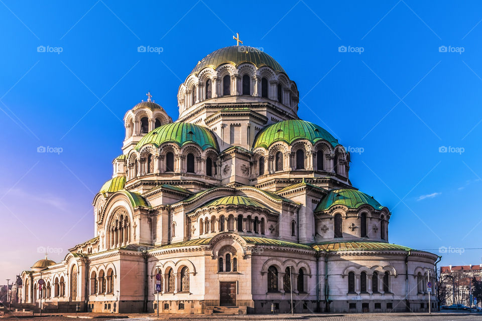 Saint Aleksander Nevsky Cathedral

The St. Alexander Nevsky Cathedral (Bulgarian: Храм-паметник „Свети Александър Невски“, Hram-pametnik „Sveti Aleksandar Nevski“) is a Bulgarian Orthodox cathedral in Sofia, the capital of Bulgaria. Built in Neo-Byzantine style, it serves as the cathedral church of the Patriarch of Bulgaria and it is one of the largest Eastern Orthodox cathedrals in the world, as well as one of Sofia's symbols and primary tourist attractions. The St. Alexander Nevsky Cathedral in Sofia occupies an area of 3,170 square metres (34,100 sq ft) and can hold 10,000 people inside.