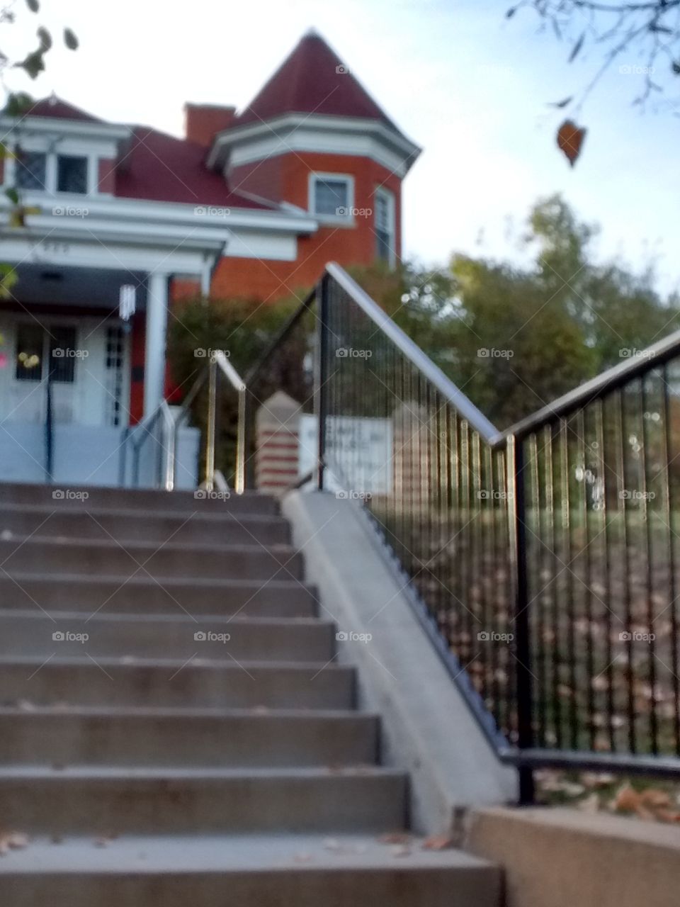 Ted brick mansion and stairs in autumn