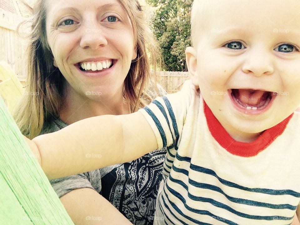 Mom and son selfie. Selfie of mom and infant toothy boy with big smile!