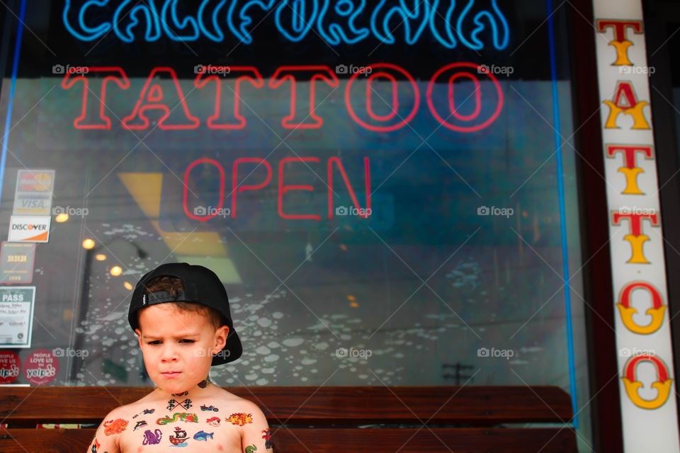 Tattoo Boy. Did a photo shoot of a little boy with fake tattoos in a tattoo parlor