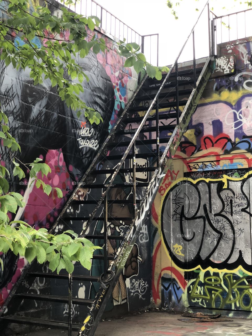 Graffiti alley stairs in Toronto, Canada, a street with many colorful graphics on the walls