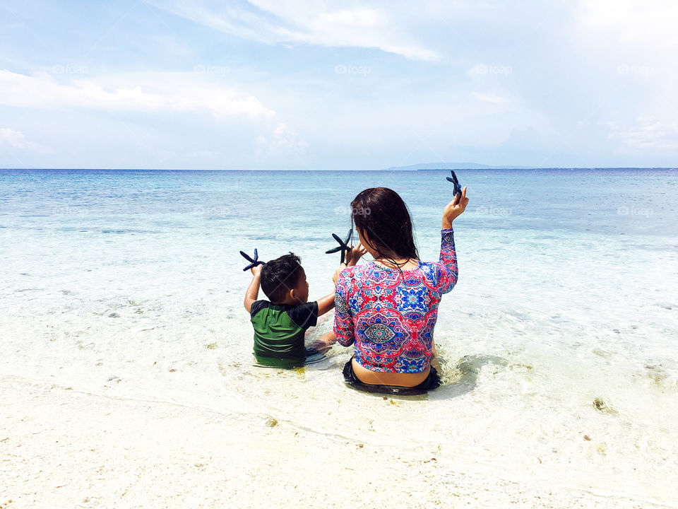 A woman and child at the beach