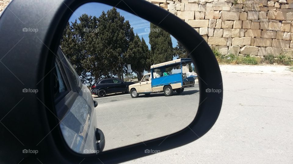 view in rear view mirror during commute