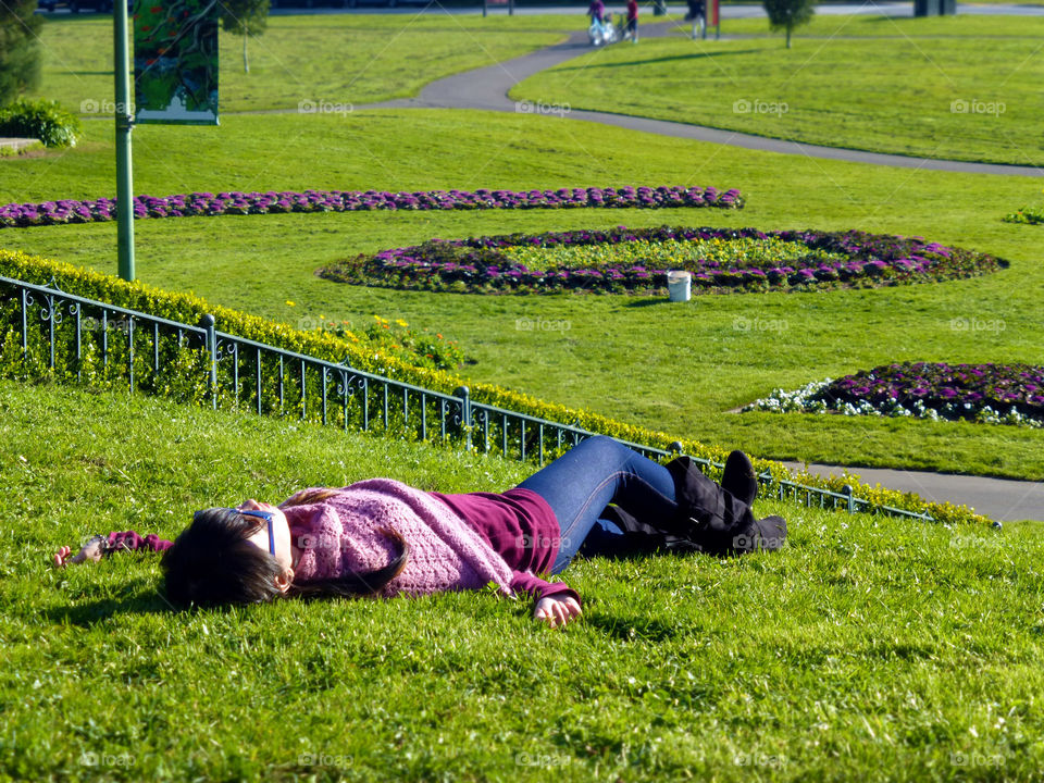 lazy girl lying in grass