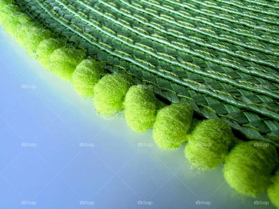 Close up of green abstract item with blobs and shadow light lines layers