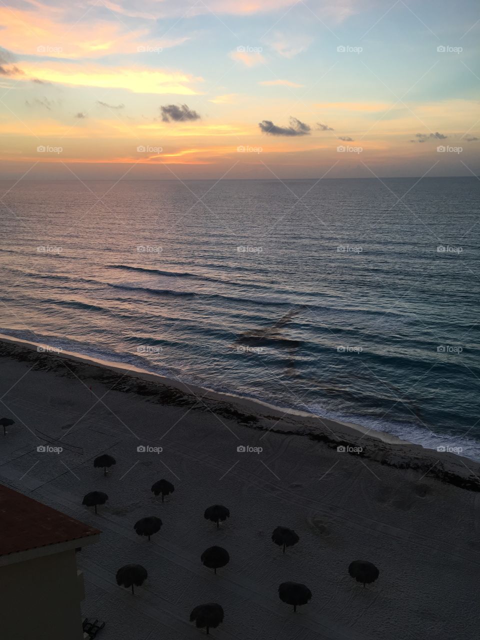 sunrise by the ocean 
cancun Mexico
