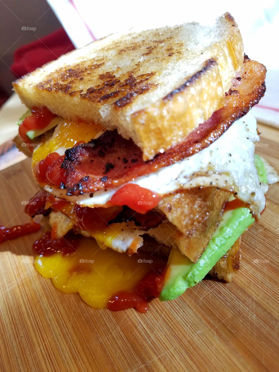 egg bacon avocado ketchup sandwich