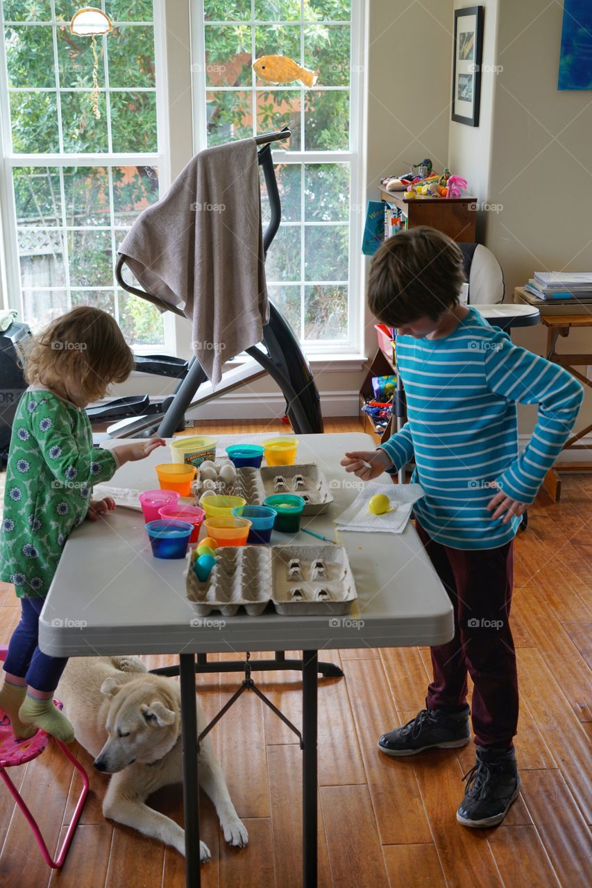 Young Children Coloring Easter Eggs