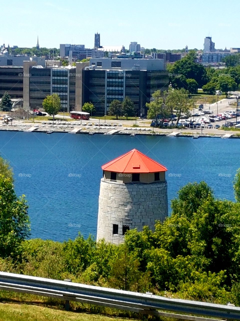 Lighthouse on the beautiful, crisp, blue waters. Found in Ottawa
