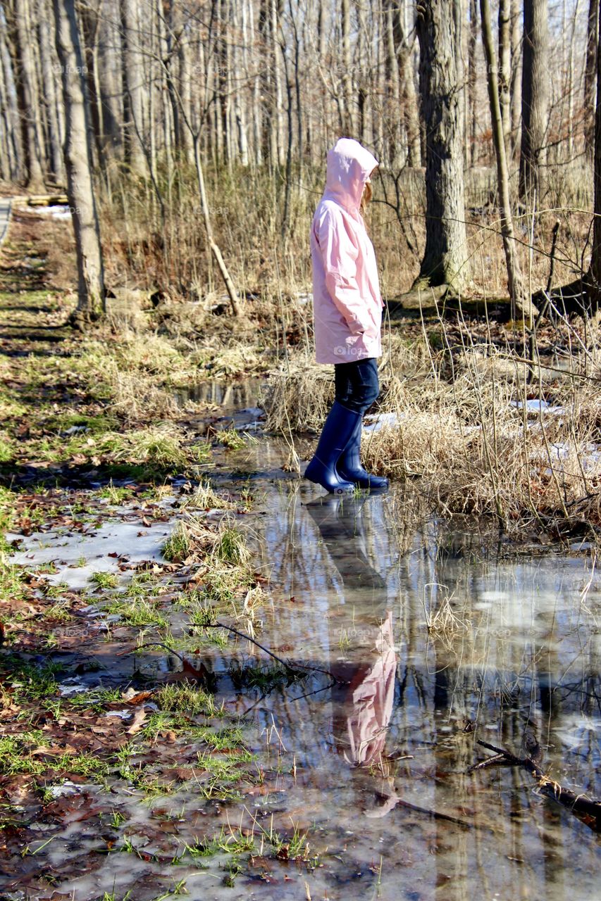 Woman wearing rain gear outdoors 