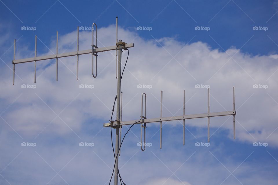 An antenna tower on top of a train station in The Borough of Queens , New York City.