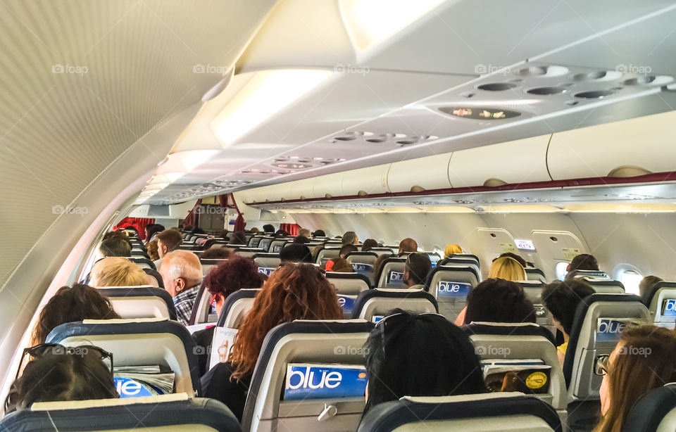 Passengers In Airplane Cabin
