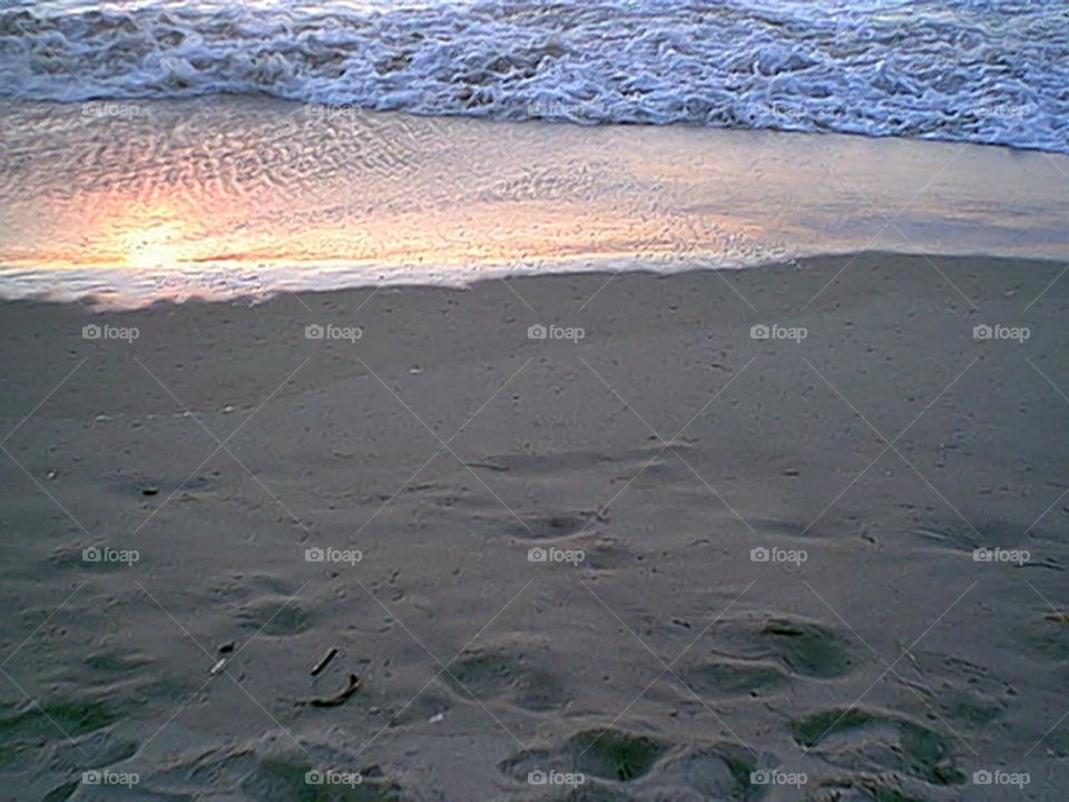 Sand with yellow reflective wave