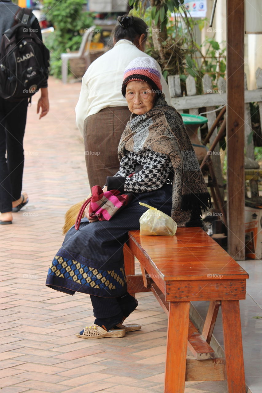 Elderly lady waiting at Luang Prabang - Laos 