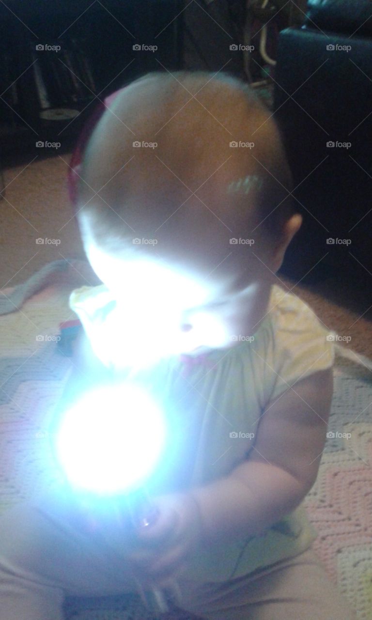 In the Spotlight. playing with the flashlight.