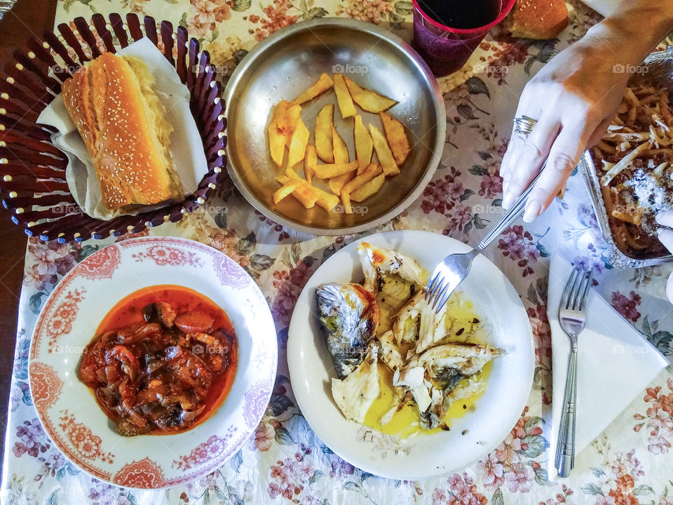 Seafood and baked food on dining table