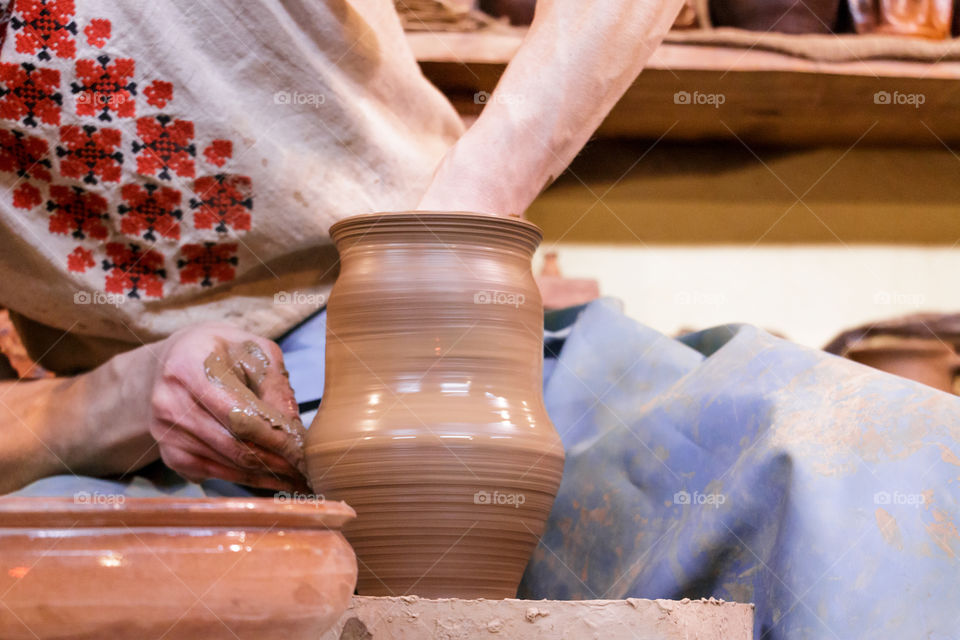 Close-up of woman making pottery
