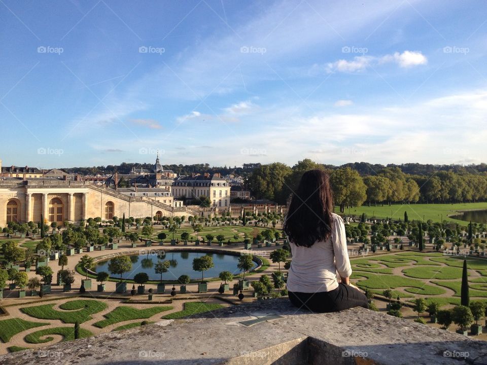 Girl overlooking garden 