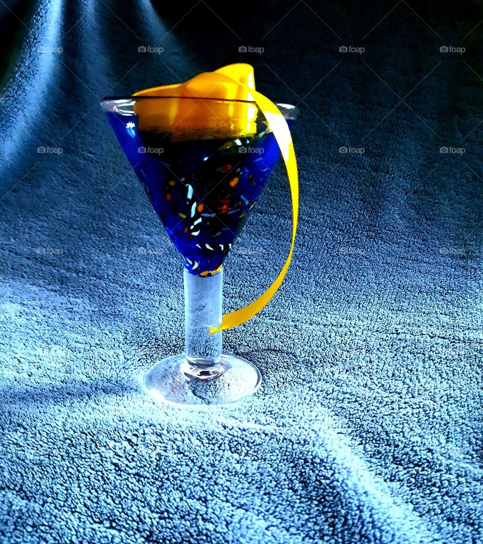 coloured blue glass with yellow ribbon