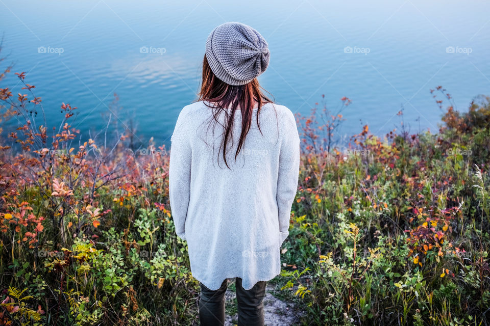 Rear view of woman looking at lake