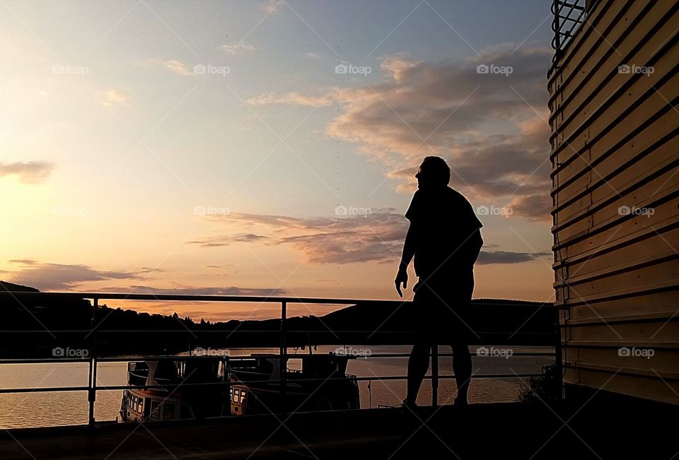 Man photographing the sunset