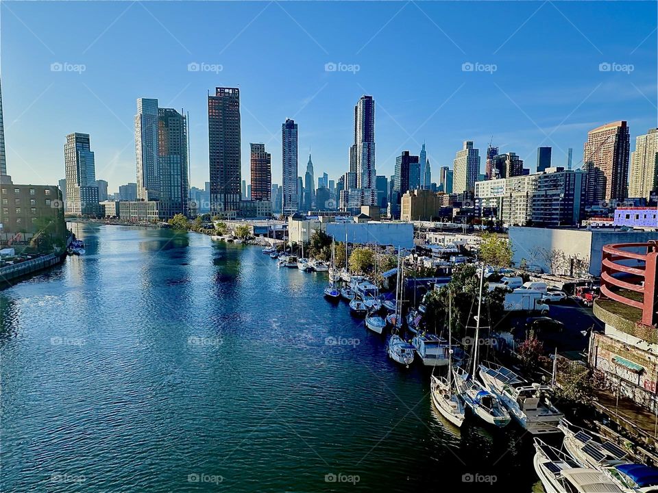 This is “Newtown Creek” seen from the “Pulaski Bridge” that connects “Greenpoint”, Brooklyn to LIC, Queens on a warm sunny Indian summer day in early November 2023. Hypnotic Productions