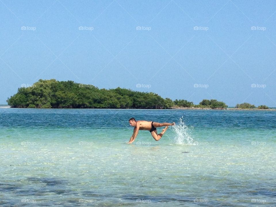 Jump out Bahia honda.  A man look like a Fish in the sea,Key west,Florida