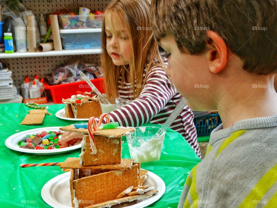 Kids Making Christmas Gingerbread Houses

