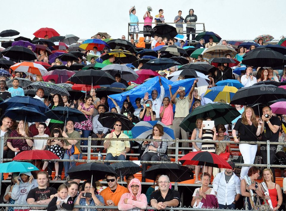 Cheering crowd in the rain