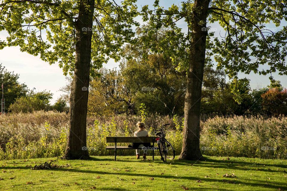 Woman sitting on a bench in malmo park