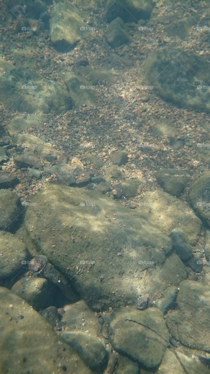 Underwater pebbles. One hot day calls for a road trip to the Bidayuh village of Bunan Gega for an awesome,  cold, refreshing dip in the clear, mountain river.