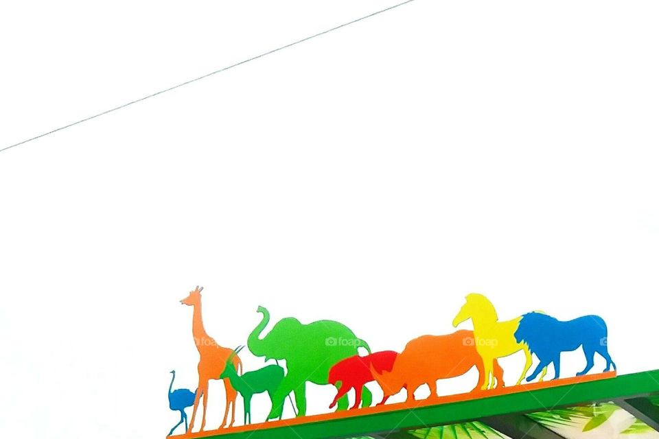 Colorful animal silhouettes on a bus stop near the zoo