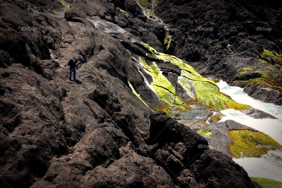 Photographer on the coastline