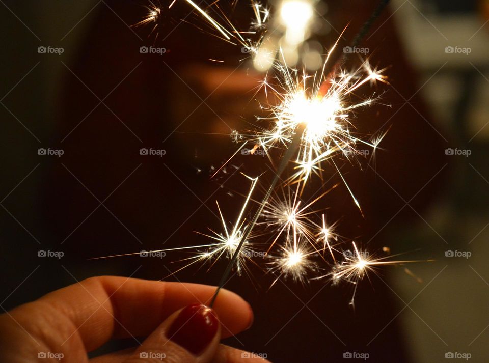 night photo bengal light in the hand Christmas holiday